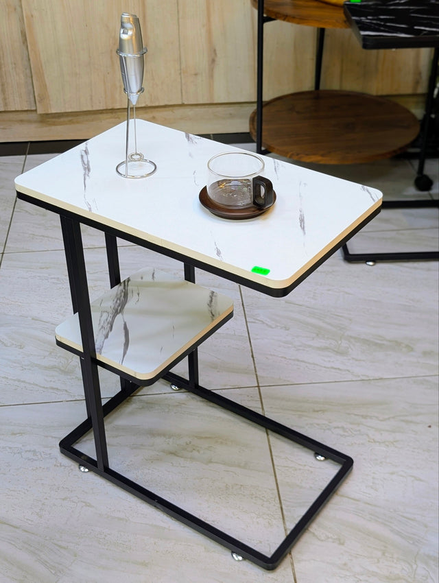 Modern white marble C-shaped side table with a black metal frame and lower storage shelf, perfect as a sofa side table, bedside table, laptop table, or accent table.