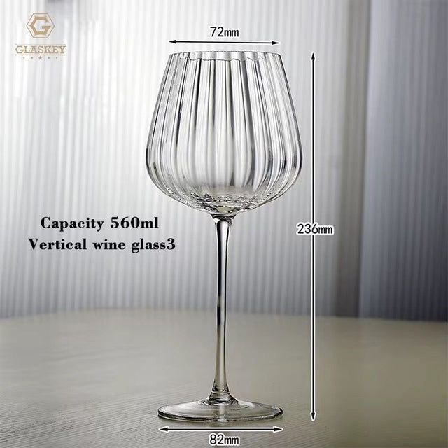 Clear wine glass with measurements and capacity details on a neutral background