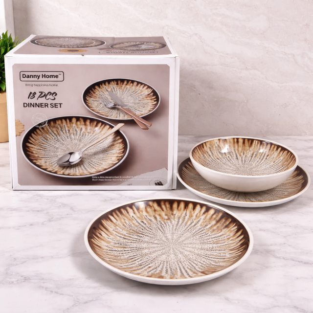 Dinner set with decorative plates and bowls in front of a Danny Home packaging box.