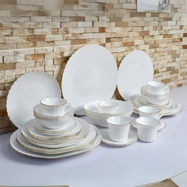 40pcs Shell Gold Rimmed Dinner Set
A luxurious and elegant dinnerware collection designed to elevate your dining experience with its beautiful shell design and gold-rimmed finish.
Set Includes:
✅ 6 Dinner Plates
✅ 6 Side Plates
✅ 6 Soup Bowls
✅ 6 Cups + 6 Saucers
✅ 6 Soup Plates
✅ 2 Serving Platters
✅ 2 Serving Bowls