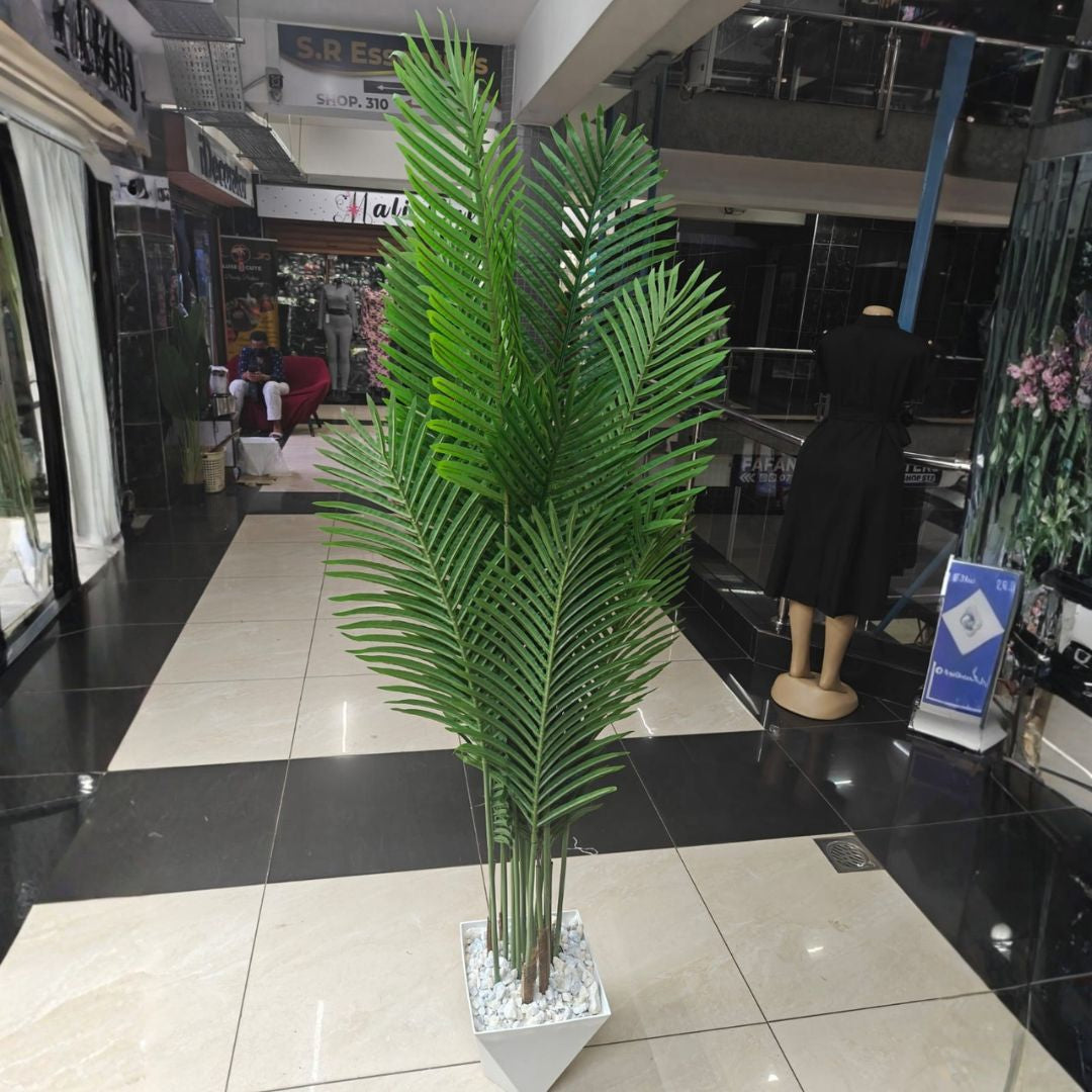 artificial palm leaf indoor plant with decorative plastic vase