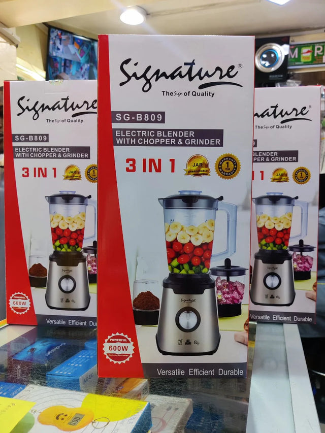 Packaging for the Signature S-G808 3-in-1 electric blender, displaying the blender with fruits and vegetables, indicating its versatility for blending, chopping, and mixing.