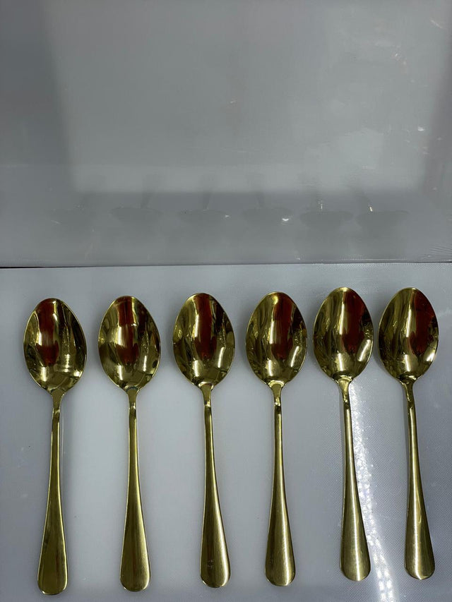 Six gold tea spoons l