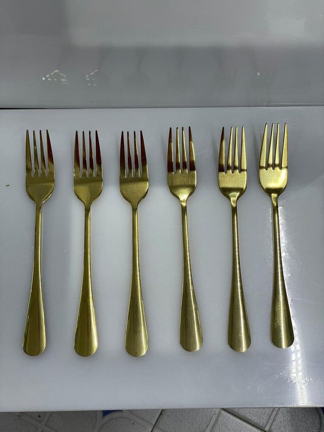 Set of six gold forks