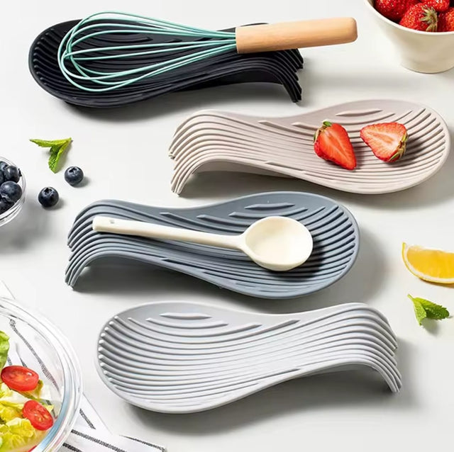 Heat-resistant silicone spoon rest for holding spoons, ladles, spatulas and whisks while keeping kitchen countertops clean