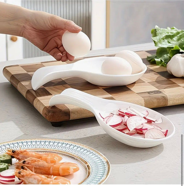 Kitchen spoon rest and ladle holder with drip tray for spoons, ladles, spatulas and cooking utensils.