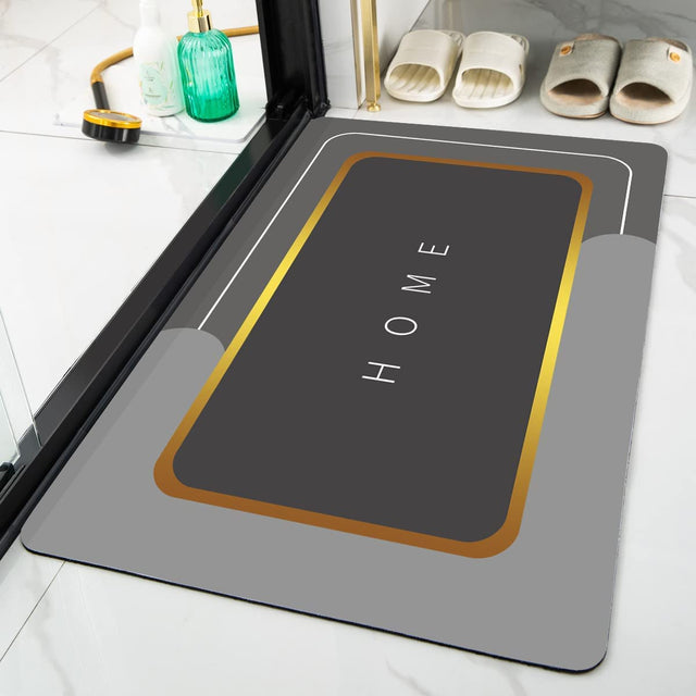 Gray doormat with 'HOME' text on a bathroom floor