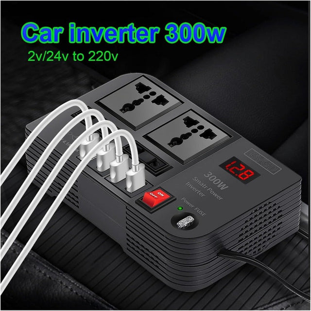 A black car power inverter with multiple AC sockets and USB ports, displaying a digital readout of voltage, installed in a vehicle.