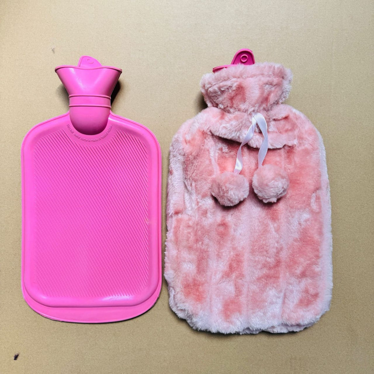 pink hot water bottle with a free fleece cover 2liters