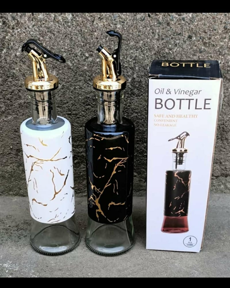 Bottle oil dispensers with marble effects