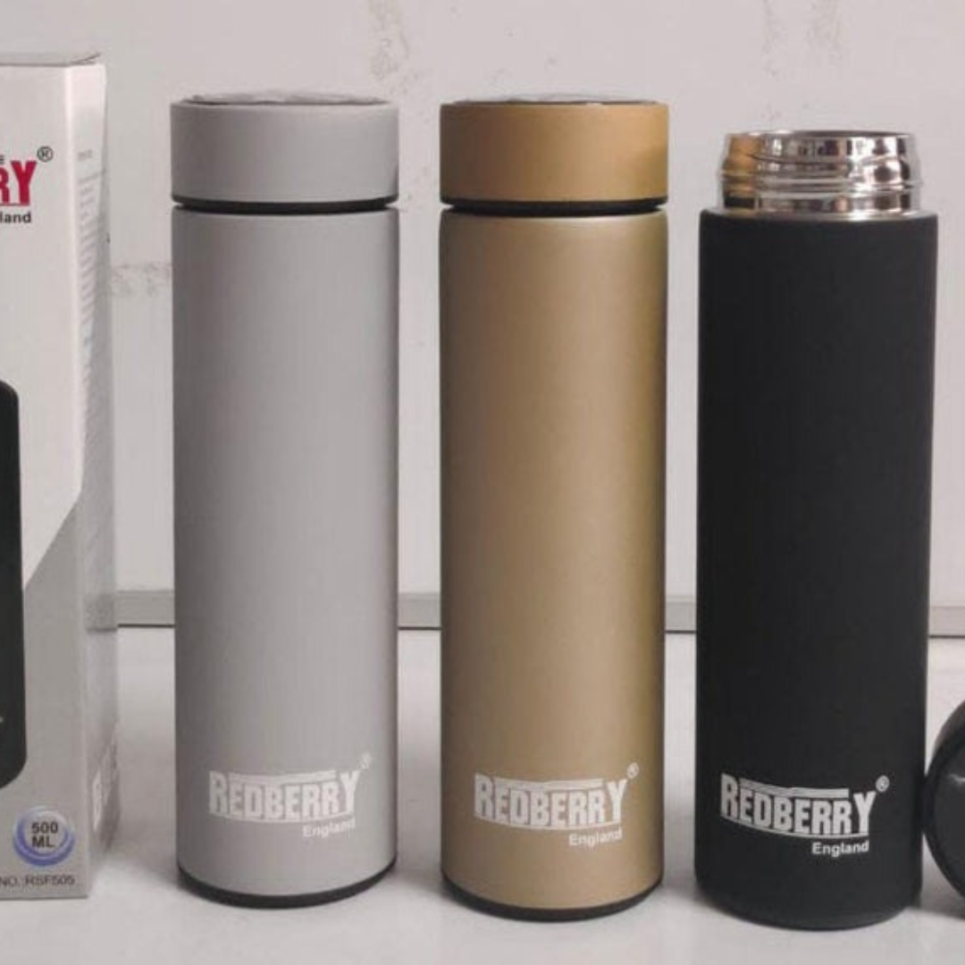 Three stainless steel thermo flasks side by side in gray, brown, and black colors, with the brand 'RED BERRY' visible on each.