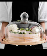 Large size glass cake cover with wooden holder.