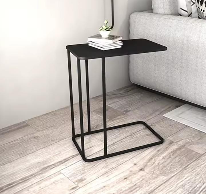 Black metallic C-shaped sofa side table with rectangular top and space-saving design