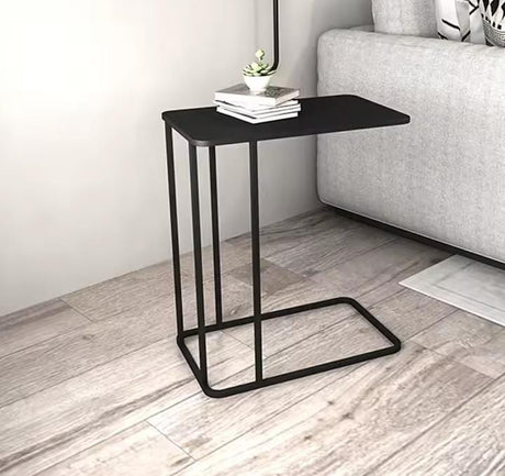 Black metallic C-shaped sofa side table with rectangular top and space-saving design