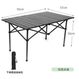 A foldable picnic camping table in gray with dimensions labeled, including a carry bag.