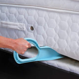 A tool being used to lift a mattress, with a blue handle and a white mattress pad.
