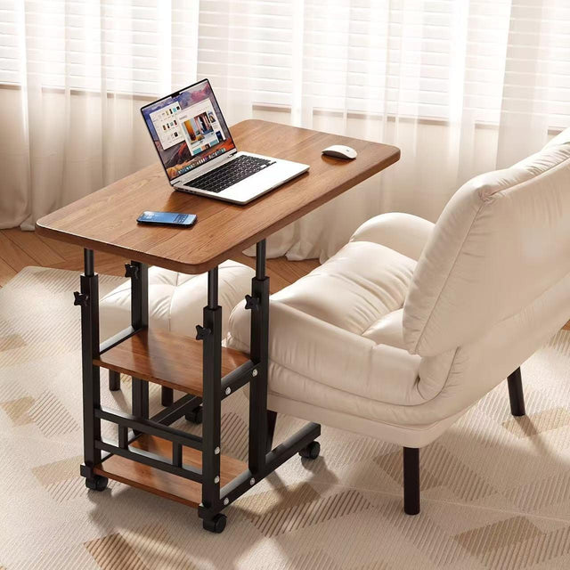 Adjustable mobile laptop desk with storage shelf, wheels, and height adjustment from 63–90cm. Perfect for bed, sofa, study, and home office use.