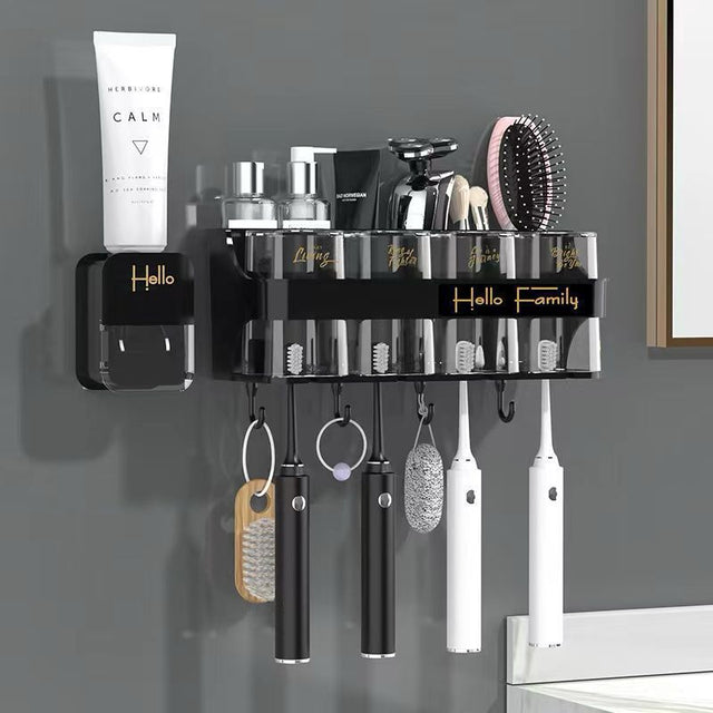 Black wall-mounted bathroom organizer with toothbrush holder, rinsing cups, storage shelf and hanging hooks