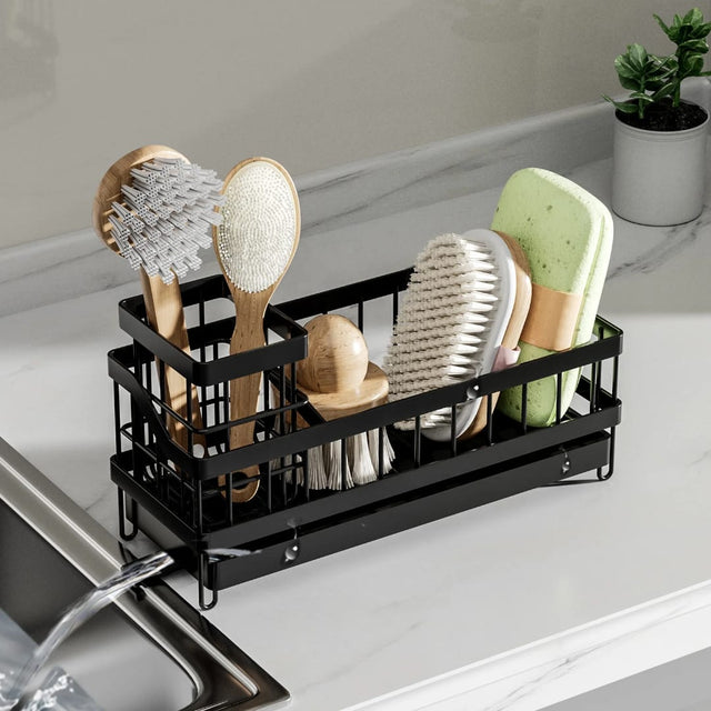 Metal sink caddy organizer with adjustable dividers and drain tray for storing sponges, soap, brushes and cleaning supplies.