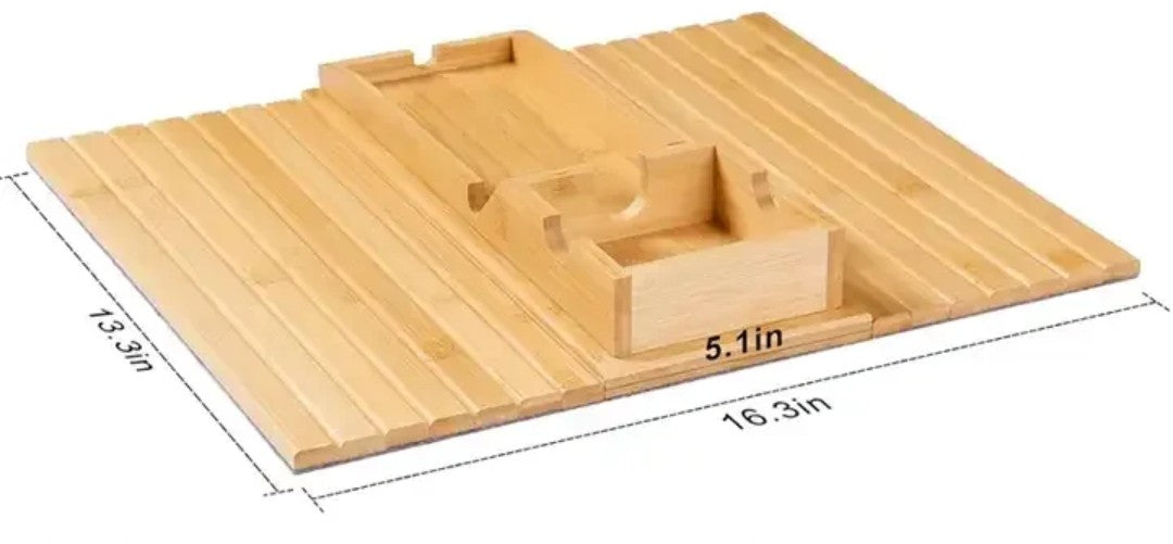 
Foldable natural bamboo sofa armrest tray measuring 16.3 by 13.3 inches with 5.1-inch built-in cup holder box, phone slot and flat surface for remote and snacks, shown clipped over a grey couch arm with a mug and TV remote — available at iDecorators Kenya, Nairobi. WITH DIMENSIONS