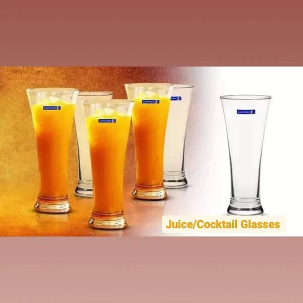 A set of six juice or cocktail glasses, with one glass showing a orange-colored drink and a blue mark on the side, indicating the brand 'Sterling'.