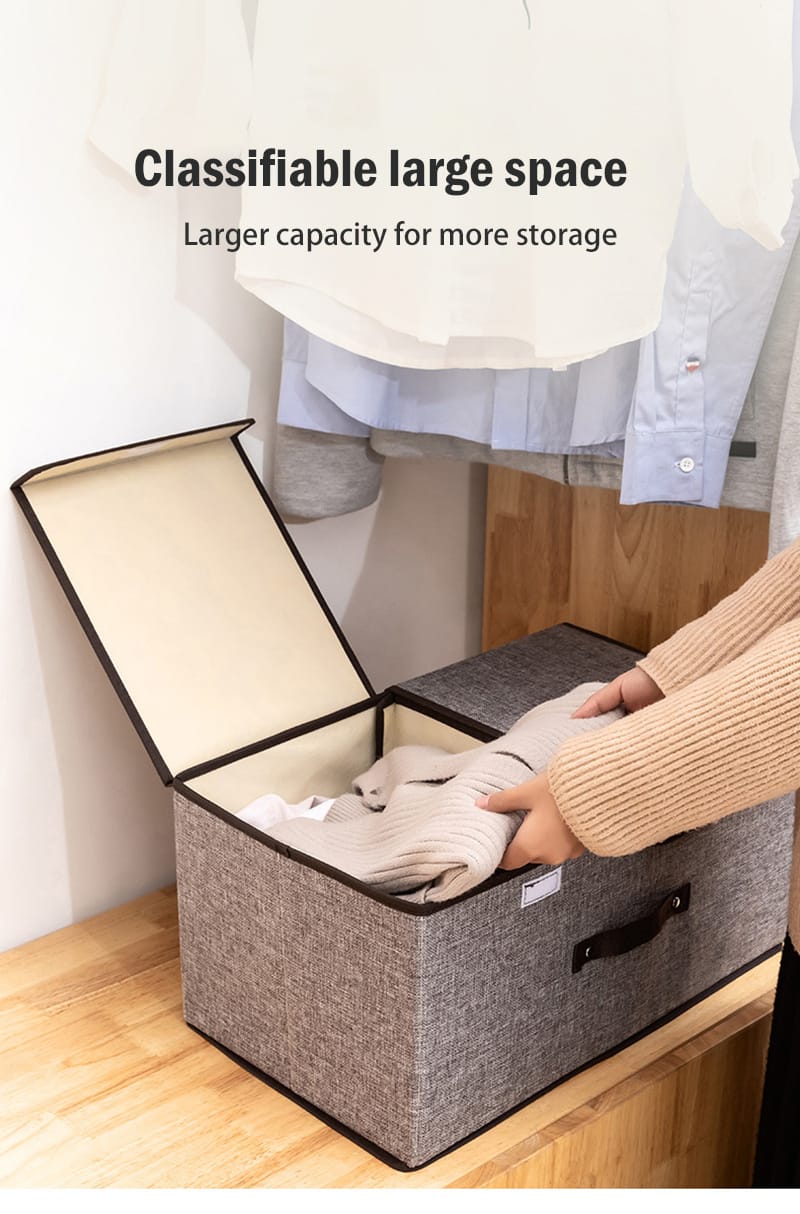 Gray storage box with a lid being opened, with text indicating larger capacity for storage.
