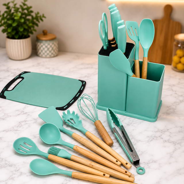 Mint green silicone kitchen utensil set with wooden handles, storage holder, tongs, whisk, spatulas and cutting board