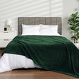 Emerald Green: Ribbed fleece blanket emerald green flannel on bed bedroom — iDecorators Kenya