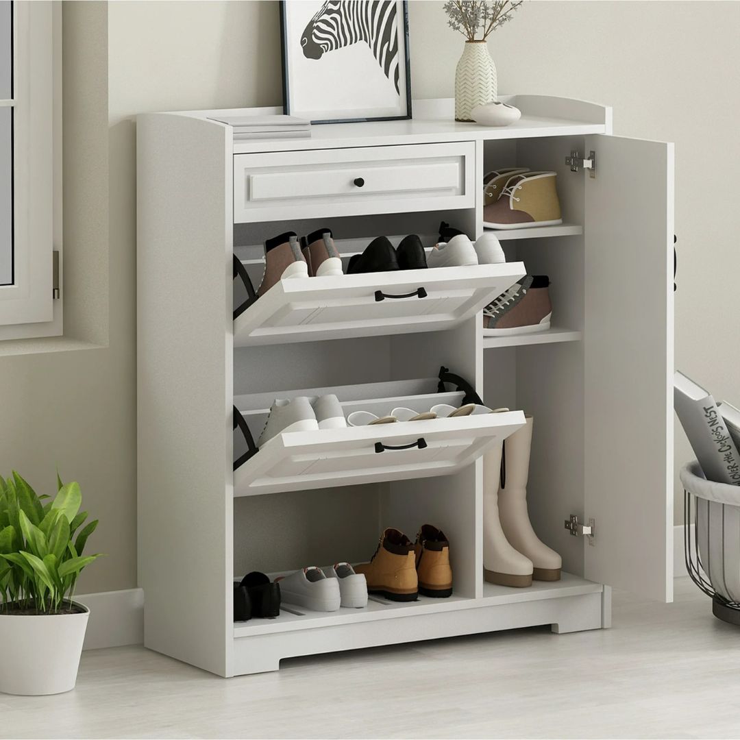 White shoe cabinet with open doors displaying various shoes in a room setting.