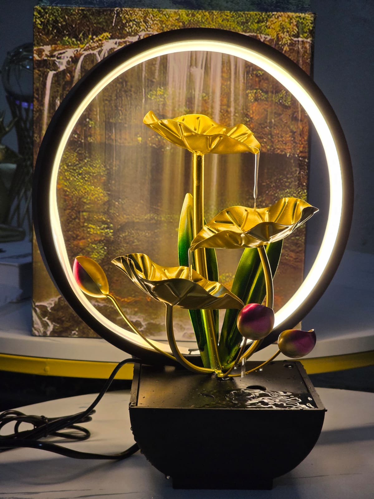 Tabletop water fountain with LED ring lights 