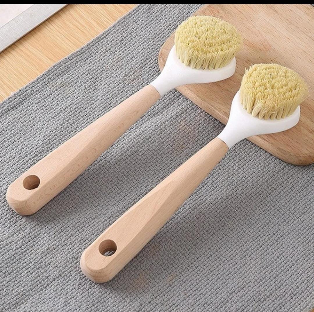 Kitchen /surface cleaning brush with wooden handle.