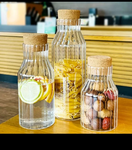Modern Borosilicate Glass Storage Jars with Acacia Wooden Cork Lids (Set of 3)
Clear ribbed borosilicate glass jars with natural acacia wood cork lids

Stylish and functional for storing beverages, water, or pantry essentials

Heat-resistant, durable, and visually elegant — perfect for modern kitchens

Set includes 3 jars with the following capacities:
• 650 ml
• 850 ml
• 1000 ml