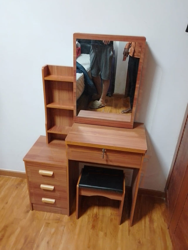Dressing table with sliding mirror