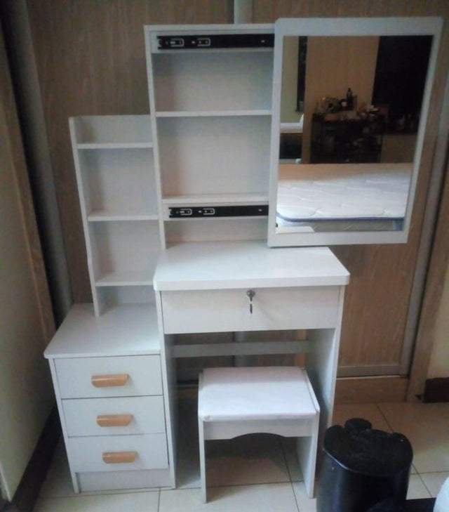 Dressing table with sliding mirror