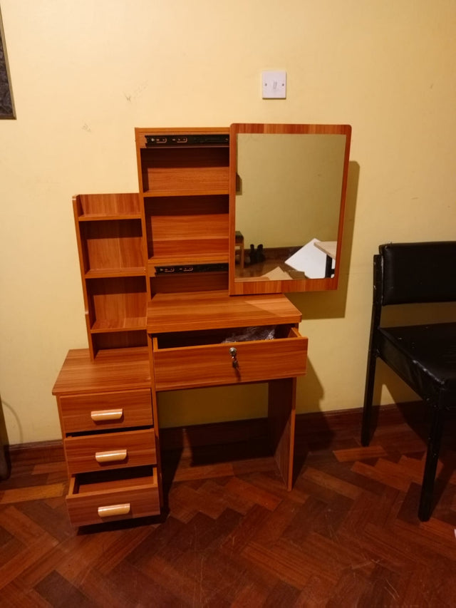 Dressing table with sliding mirror