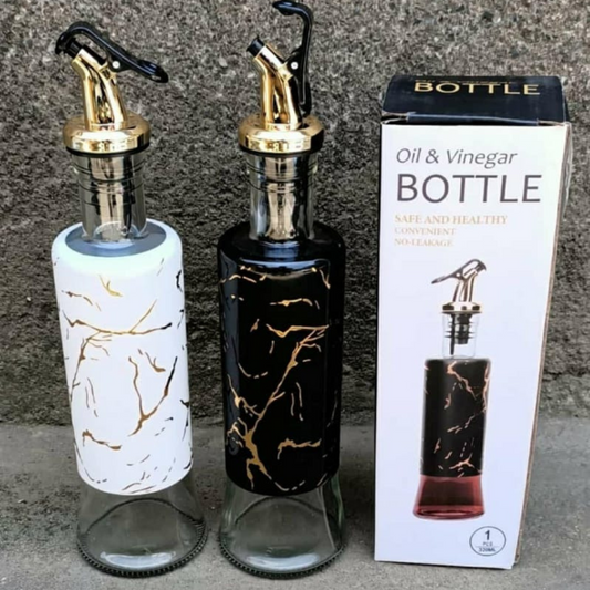 Bottle oil dispensers with marble effects