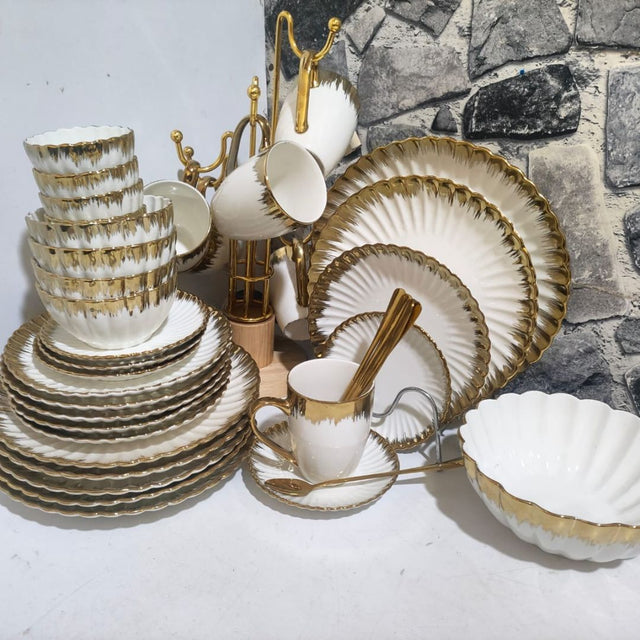 44-Piece Shell Dinner Set – Elegant & Complete Tableware Collection

Material: High-quality ceramic with a delicate shell-inspired design

Design: Timeless and elegant, suitable for both daily dining and special occasions

Set Includes:
• 6 pcs dinner plates (10")
• 6 pcs side plates (8")
• 6 pcs saucers (6")
• 6 pcs bowls (4.5")
• 6 pcs sauce bowls (3.5")
• 6 pcs cups
• 6 pcs teaspoons
• 1 serving platter
• 1 serving bowl

Perfect for families or entertaining guests with a coordinated and elegant table set