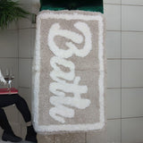 Material: Made from ultra-soft microfiber for a plush, comfortable feel underfoot.

Absorbency: Quickly absorbs water, keeping your bathroom floor dry and slip-free.

Backing: Non-slip rubber or latex backing for enhanced safety and grip.

Design: Simple, elegant design that complements most bathroom interiors.

Use: Ideal for placing near the shower, bathtub, or bathroom entrance.

Care: Machine washable and quick-drying for easy maintenance.