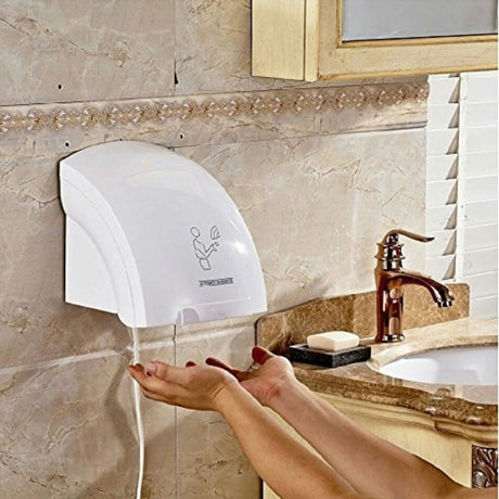 Automatic Infrared Sensor Hand Dryer – Hotel & Bathroom Use

Touch-Free Operation: Activates automatically using infrared sensor for hygienic, hands-free drying.

Fast Drying: Powerful motor delivers quick and efficient hand drying in seconds.

Durable Build: Made with high-quality materials suitable for commercial and high-traffic restrooms.

Energy Efficient: Consumes minimal power while delivering strong airflow.

Wall-Mounted Design: Saves space and ideal for hotels, offices, and public washrooms.
