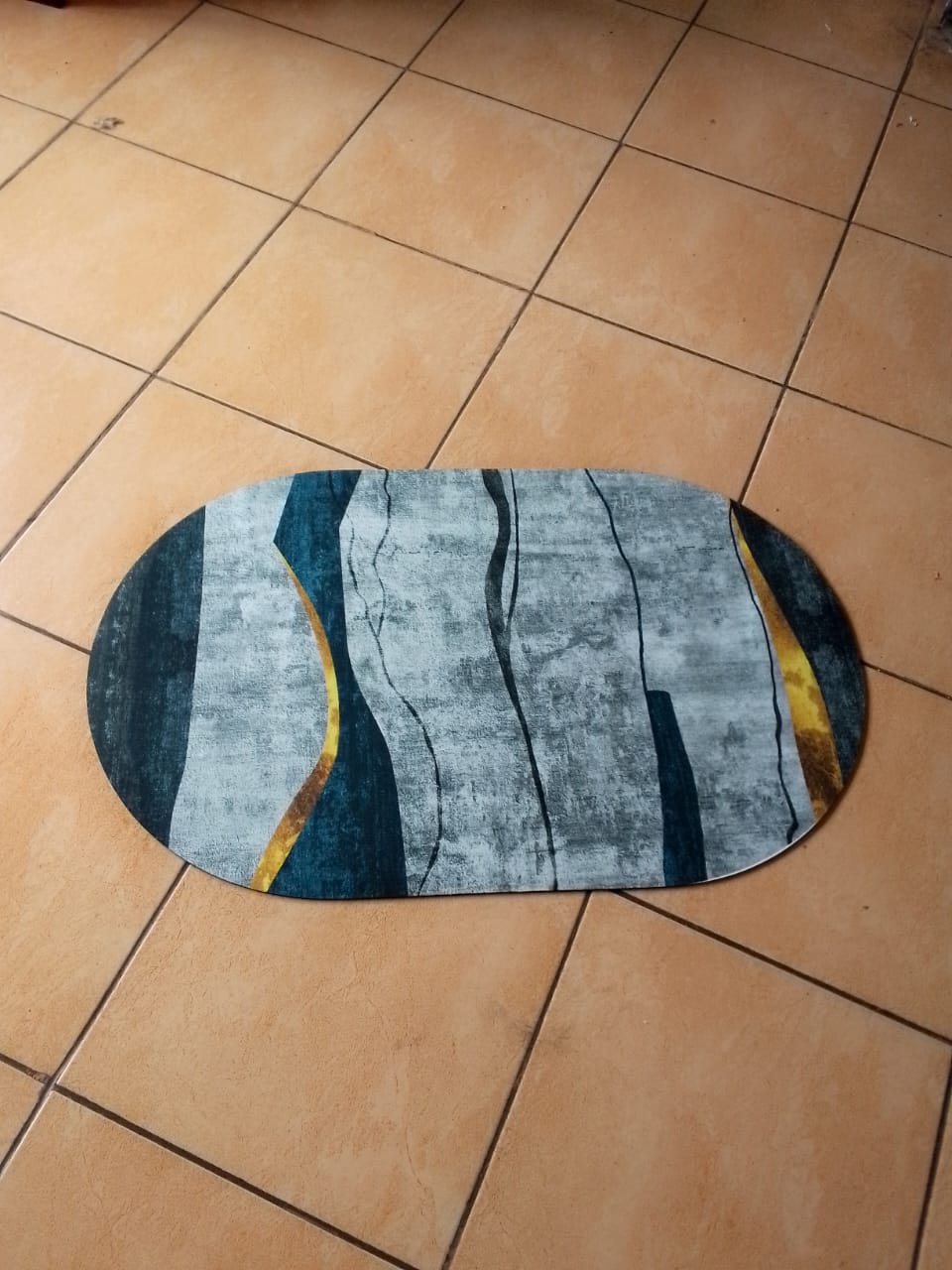 Oval shaped absorbent bathroom mat