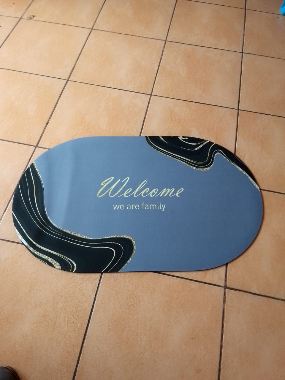 Oval shaped absorbent bathroom mat