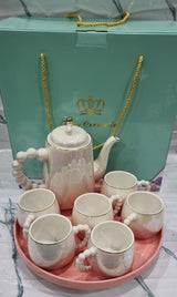 Fine ceramic 8pc Rotating tray tea set with 6 cups and kettle