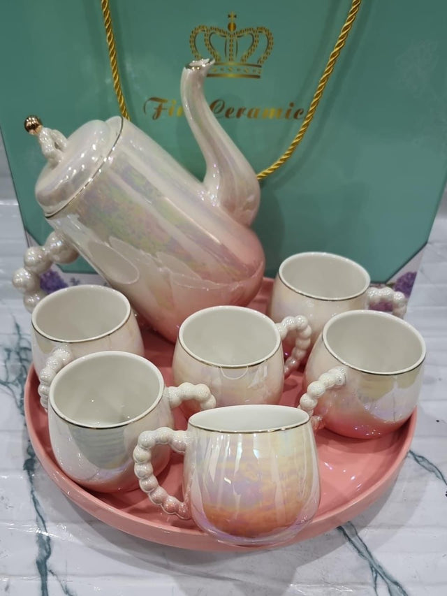Fine ceramic 8pc Rotating tray tea set with 6 cups and kettle