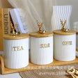 * Porcelain ceramic canisters
* Bamboo lids for freshness
* Comes with bamboo tray & gold reindeer décor
* Elegant and durable kitchen storage