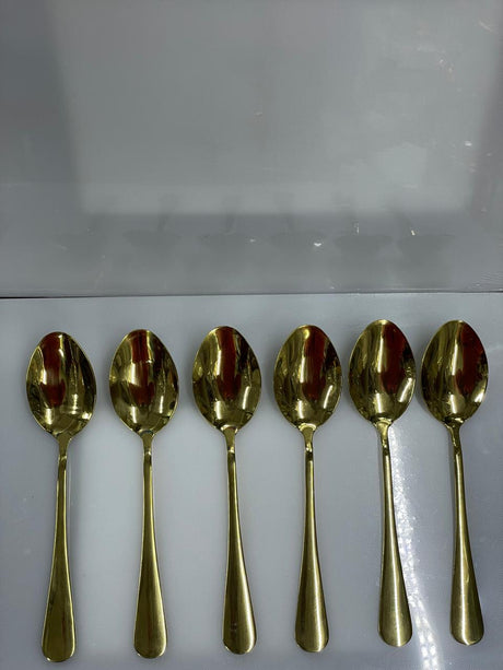 Six gold tea spoons l