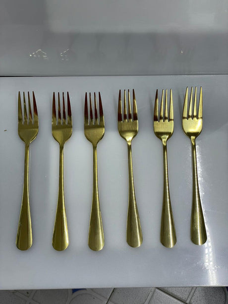 Set of six gold forks