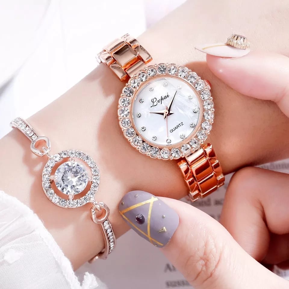 Rose gold watch with diamond accents on a wrist, close-up view.