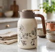 Feenik Creamy Beige Insulated Vacuum Flask with 3D Floral Pattern and Lever Top — 2L spn