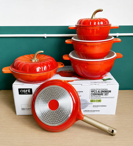 9-piece non-stick aluminium cookware set with three casserole pots, lids, and frying pan in a modern pumpkin design.
