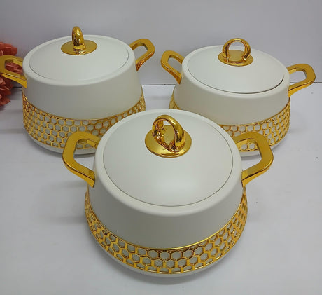 Luxury insulated hot pots with stainless steel interiors, white exterior, gold handles, and decorative gold stand in 2000ml, 2500ml, and 3000ml sizes.